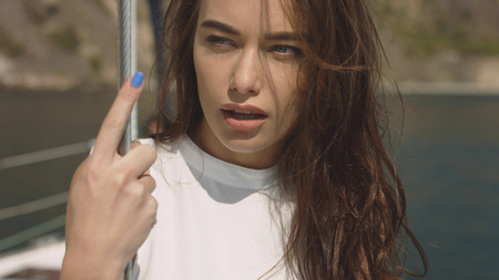 Beauty sexy brunette girl on the yachtの写真素材