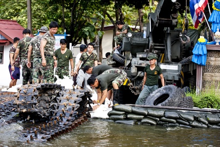 Bangkok, Thailand - November 5, 2011: Soldiers try to protect flooding.のeditorial素材