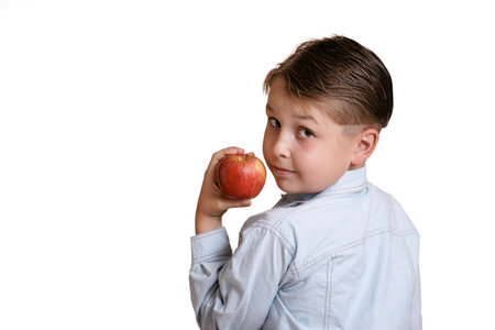 Boy with red appleの写真素材