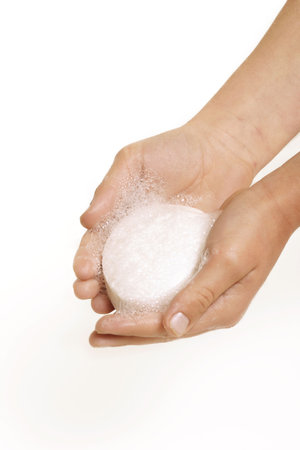 Soap, lather, bubbles in the palm of a child