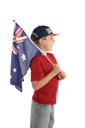 An Australian boy holding a flag and facing sideways.の写真素材
