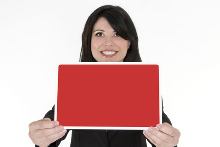 Female holding in front of her a blank red and white signの写真素材