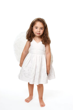 Divine little angel standing on a white background.の写真素材