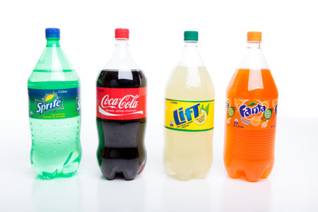 Bottles of carbonated softdrinks.  Varieties are Sprite, Coca Cola, Lift and Fanta.  All drinks made by Coca Cola.のeditorial素材