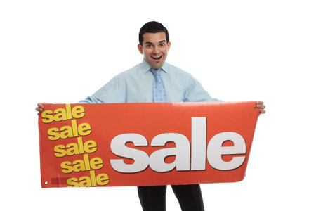 An excited man holding a sale sign ready for a retail or other type of sale.  White background.の写真素材