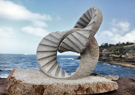 BONDI BEACH, AUSTRALIA - OCTOBER 30, 2013: Sculpture By The Sea, Bondi 2013. Annual event that showcases artists from around the world  Sculpture titled '2 rings' by Keizo Ushio, medium, granite $115000.  Image has been toned.
のeditorial素材
