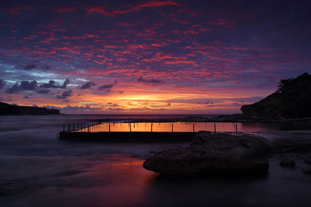 Dawn skies over Malabar Rock Pool and Long Bay, Sydney Australiaの写真素材