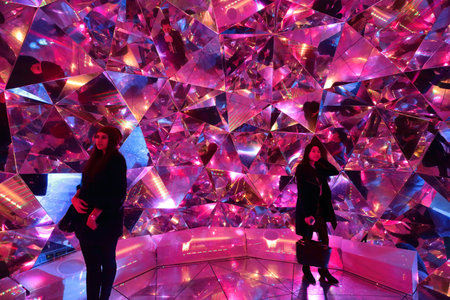 SYDNEY AUSTRALIA  MAY 25 2015  Tourists enjoy the experience inside Light Origami at Vivid Sydney which invites viewers to explore the nature of reality by entering a giant 3D kaleidoscope. The domed structure is bathed in light and is constructed using oのeditorial素材