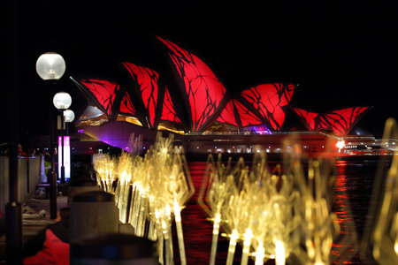 SYDNEY, AUSTRALIA - MAY 27, 2015,  The Sydney Opera House in vivid red and harbour reflections. のeditorial素材