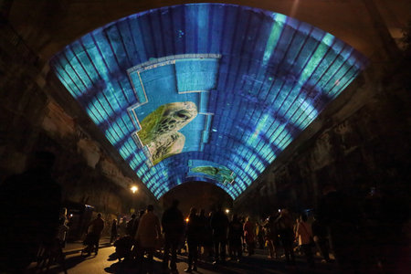 SYDNEY, AUSTRALIA - JUNE 3, 2015 -  Public and tourists watch in awe the amazing projection pictures...