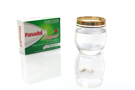 SYDNEY, AUSTRALIA - JULY 20, 2015;  A box of Panodol Rapid, pharmacy medication for the relief of pain contains paracetamol.  Shot in studio isolated white background.のeditorial素材
