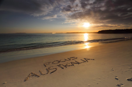 Early morning along Greenpatch Beach..  The sun shimmering on the water   Australia is the most beautiful and diverse scenic place to visitの写真素材