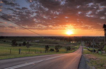 Sunrise over the farmlands and rural part of Penrith called Orchard Hillsの写真素材