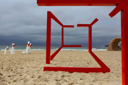 BONDI, AUSTRALIA - OCTOBER 22, 2015;  Annual Sculpture by the Sea free public event.  Exhibit titled  Mriage by Diedre Mair and Harry Stitt. .  A geometric form comes in and out of focus, assembles and disassembles  depending where you view it from.のeditorial素材