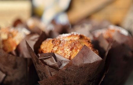 Fresh baked muffins lightly dusted with icing sugar powderの写真素材