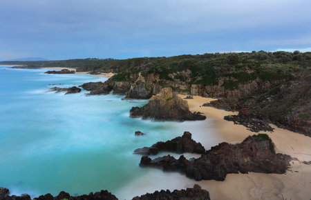 Views over the coastline with rising sea stacks at Bingie NSW Australiaの写真素材