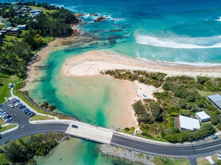 Candlagan creek is an estuary that extends five km inland. The tidal flows at its mouth are popular with youth and adults with the east side of the briidge being a popular jump spot into the water, and the fish breeding grounds starting just beyond the bridge to its west.の写真素材