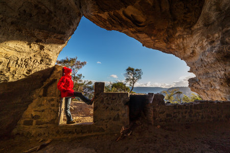 Standing in a cave at cliff edge in the upper Blue Mountains Australiaの写真素材
