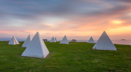 These tank traps at Port Kembla were designed to prevent an invasion by the Japanese and appeared along beaches and coastal escarpment areas along with barbed wiire to protect from enemy shipping and submarinesの写真素材