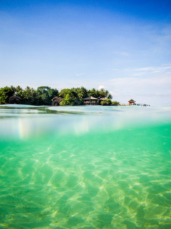 Diving under into the sea at a tropical island