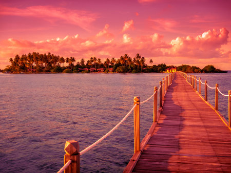 Pier leads to a tropical island in the sunsetの写真素材