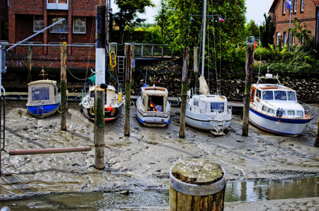 Boats in the harbor at low tideのeditorial素材