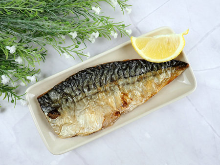 Crispy Skin Grilled Fried Saba Mackerel Fish Fillet Japanese Healthy Food Cuisine Cooking with Lemon