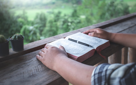 close up hand reading a holy bible. christian concept.の写真素材