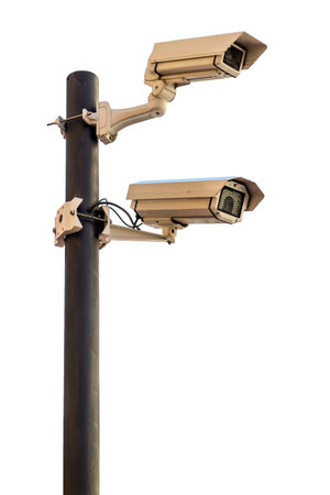 Two surveillance cameras attached to a pole on a blue gradient background with copy spaceの写真素材