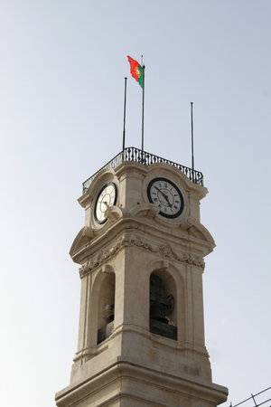 Clock tower in the city of Coimbra, Portugal. The clock tower is part of the Coimbra University.の写真素材