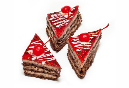Three sweet and nourishing cake with cherryの写真素材