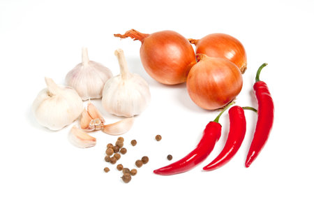 Garlic, onion, pepper and spice isolated on white backgroundの写真素材