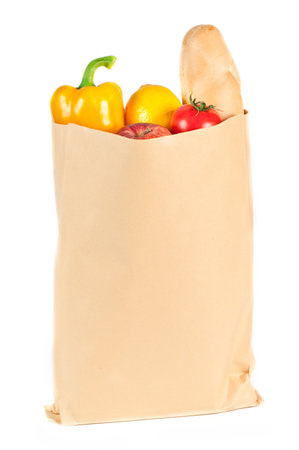 Fresh healthy groceries in a paper bag isolated on white backgroundの写真素材
