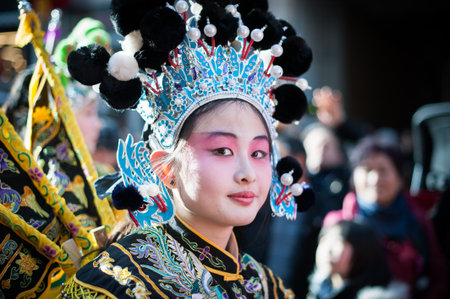 Paris, France - Feb 02, 2014: Chinese young girl performs in traditional costume at the chinese lunar new year parade.のeditorial素材
