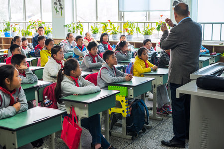 Chengdu, Sichuan province, China - March 31, 2017: Children and teacher in a chinese classroomのeditorial素材