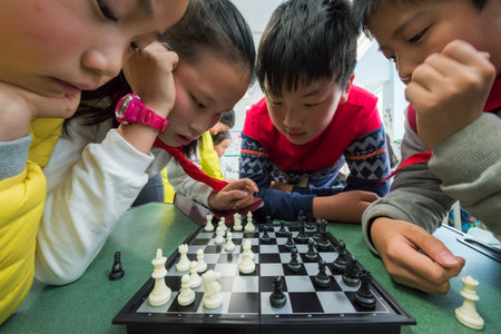 Chengdu, Sichuan province, China - March 31, 2017: children playing chess in a school, Chengdu, Sichuan Province, Chinaのeditorial素材