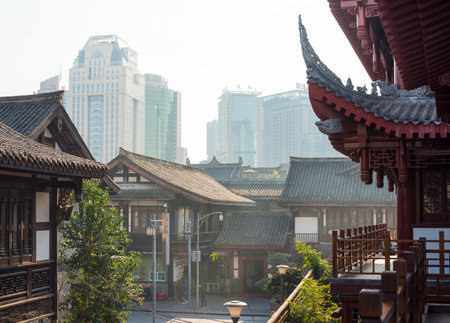 Chengdu, Sichuan Province, China - Dec 16, 2015:  Traditional chinese houses and modern buildings in the backgroundのeditorial素材