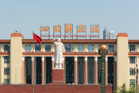 Chengdu, Sichuan Province, China - Apr 13, 2017: Mao statue and chinese flag on a sunny day in front of the Sichuan Science and Technology museum, Tianfu Square.のeditorial素材
