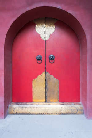 Chinese traditional red door with golden ornaments, Chengdu, Sichuan Province, Chinaの写真素材