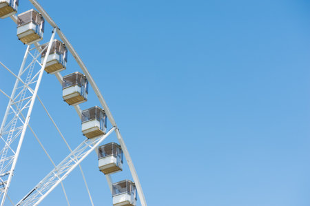 Detail of a ferris wheel against blue skyの写真素材