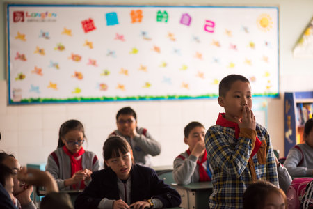 Schoolboy standing in a chinese schoolのeditorial素材