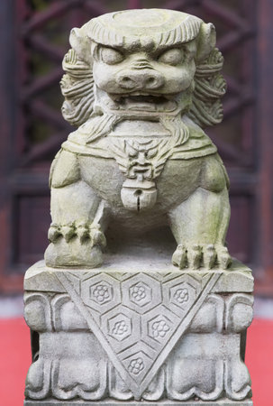 Stone lion statue in a templeの写真素材