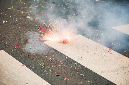Firecracker exploding on the asphalt of a streetの写真素材