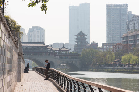 Man watching his smartphone in Chengduのeditorial素材