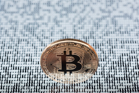 Bitcoin on binary code backgroundの写真素材
