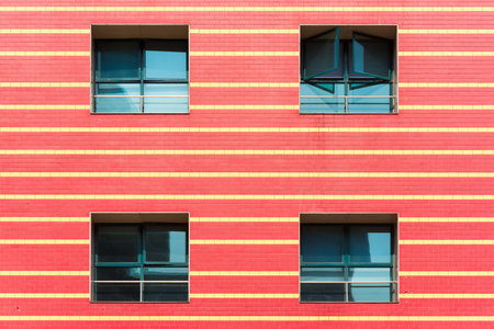 Red brick wall with yellow horizontal linesの写真素材
