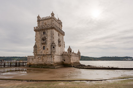 Lisbon, Portugal - Nov 21, 2013 : Belem tower close-up at low tide on a cloudy dayのeditorial素材