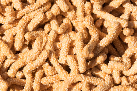 Sesame biscuits in sunlight in a chinese marketの写真素材