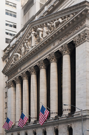 New York stock exchange facade with american flagsのeditorial素材
