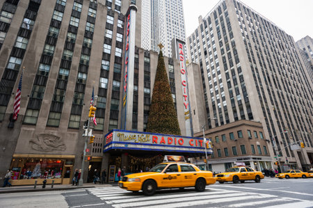Yellow taxis and traffic in front of the Radio City Music Hall